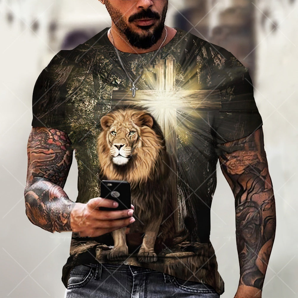 Man wearing a t-shirt with a lion and cross design, holding a phone.