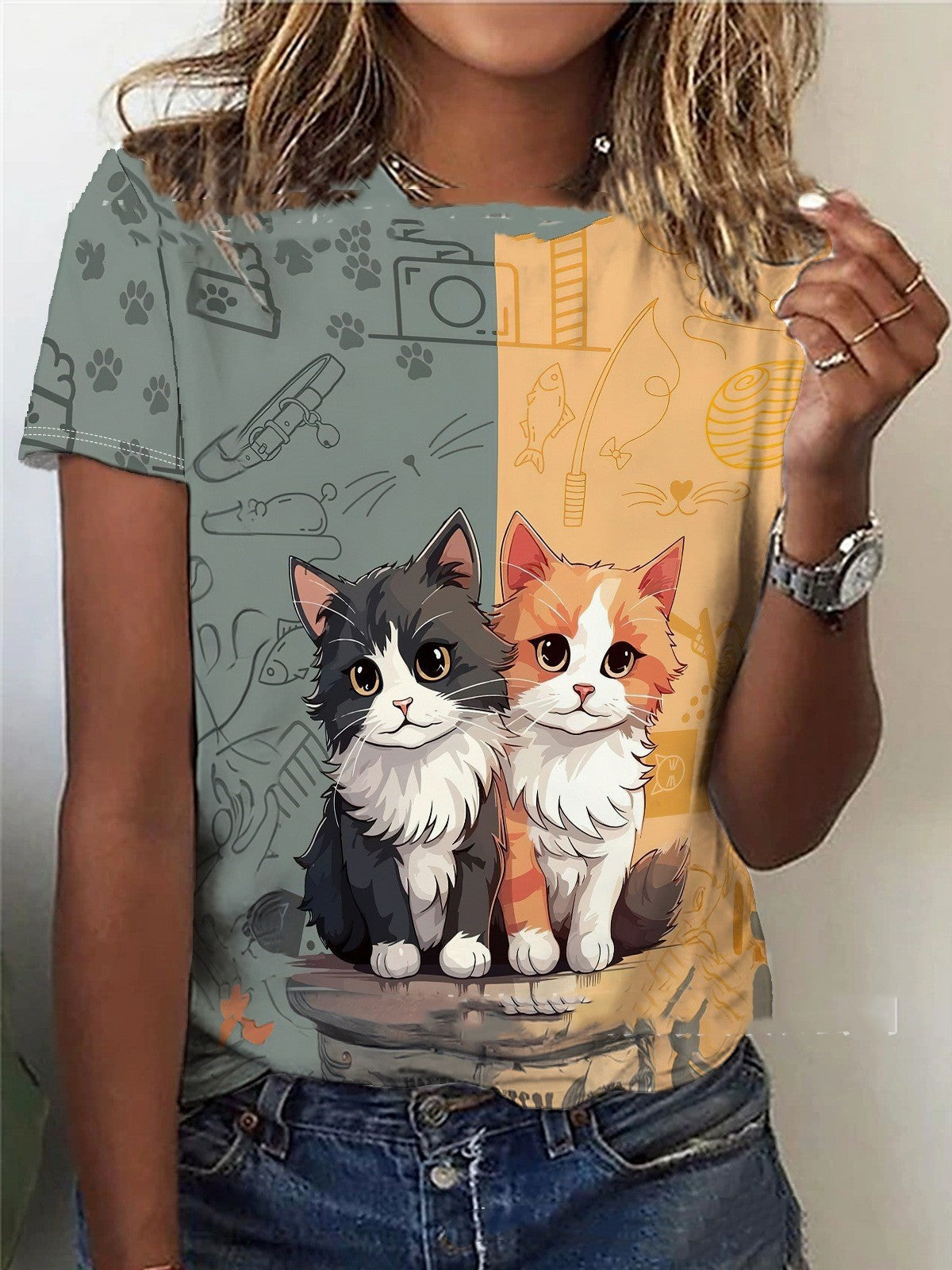 T-shirt with cartoon cats design worn by a person