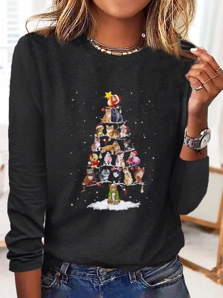 Black sweatshirt with a cat-themed Christmas tree design worn by a person.