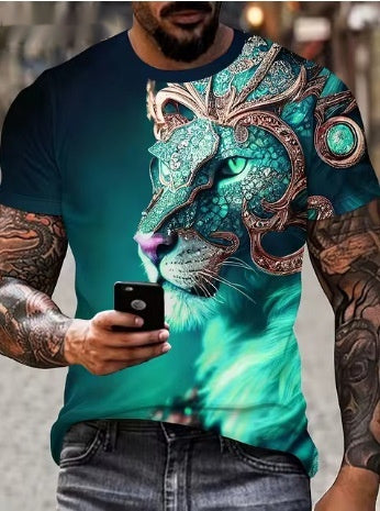 Person wearing a teal t-shirt with a decorative lion design, holding a phone.