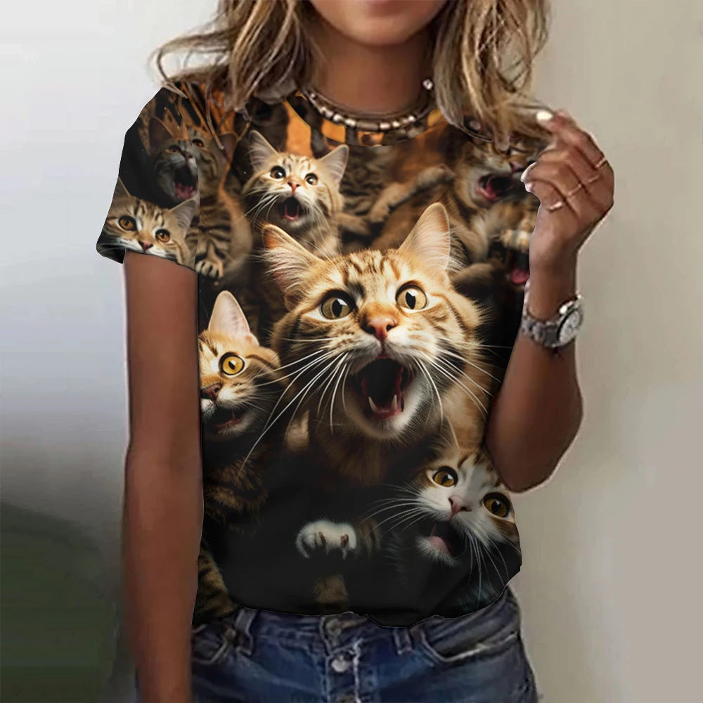Person wearing a t-shirt with a graphic of cats on a plain background