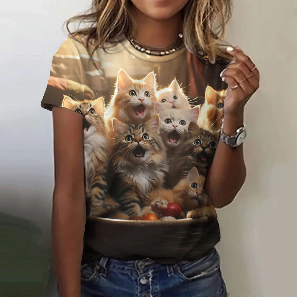 Person wearing a t-shirt with a design of kittens in a bowl.
