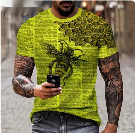 Person wearing a bright yellow t-shirt with a dragon design, holding a phone.