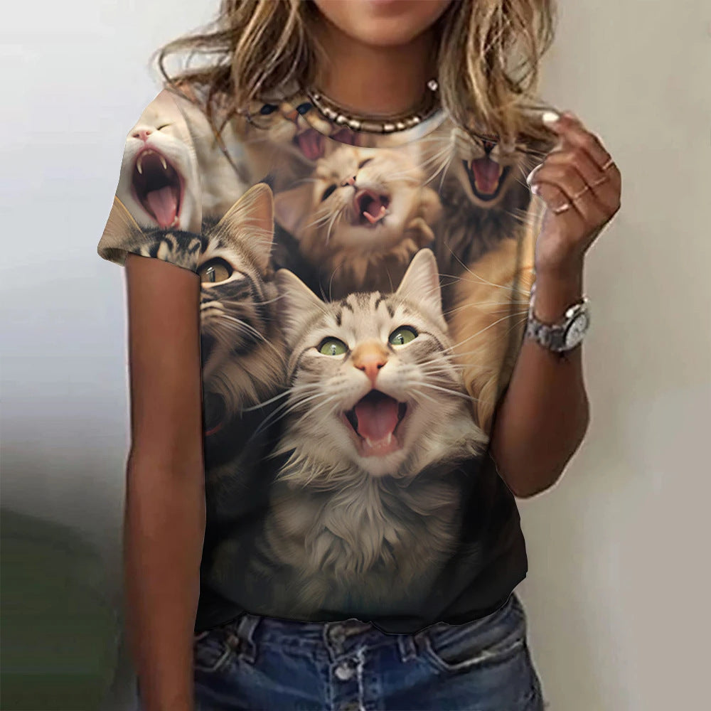 Person wearing a t-shirt with a graphic of three cats making funny faces.