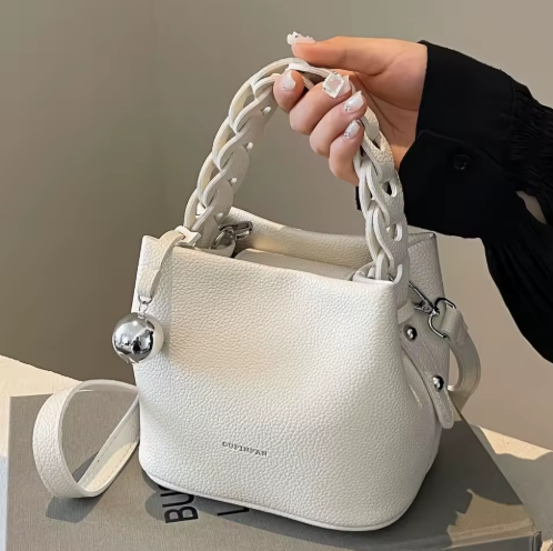 Sol Invictus Korean style woven bucket bag in litchi pattern PU leather